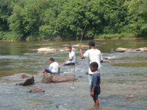 4 brothers playing in river