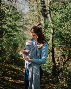 mom with baby in carrier sling